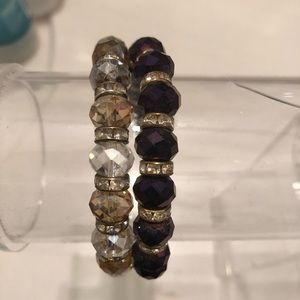 Gold and purple elastic band bracelets.